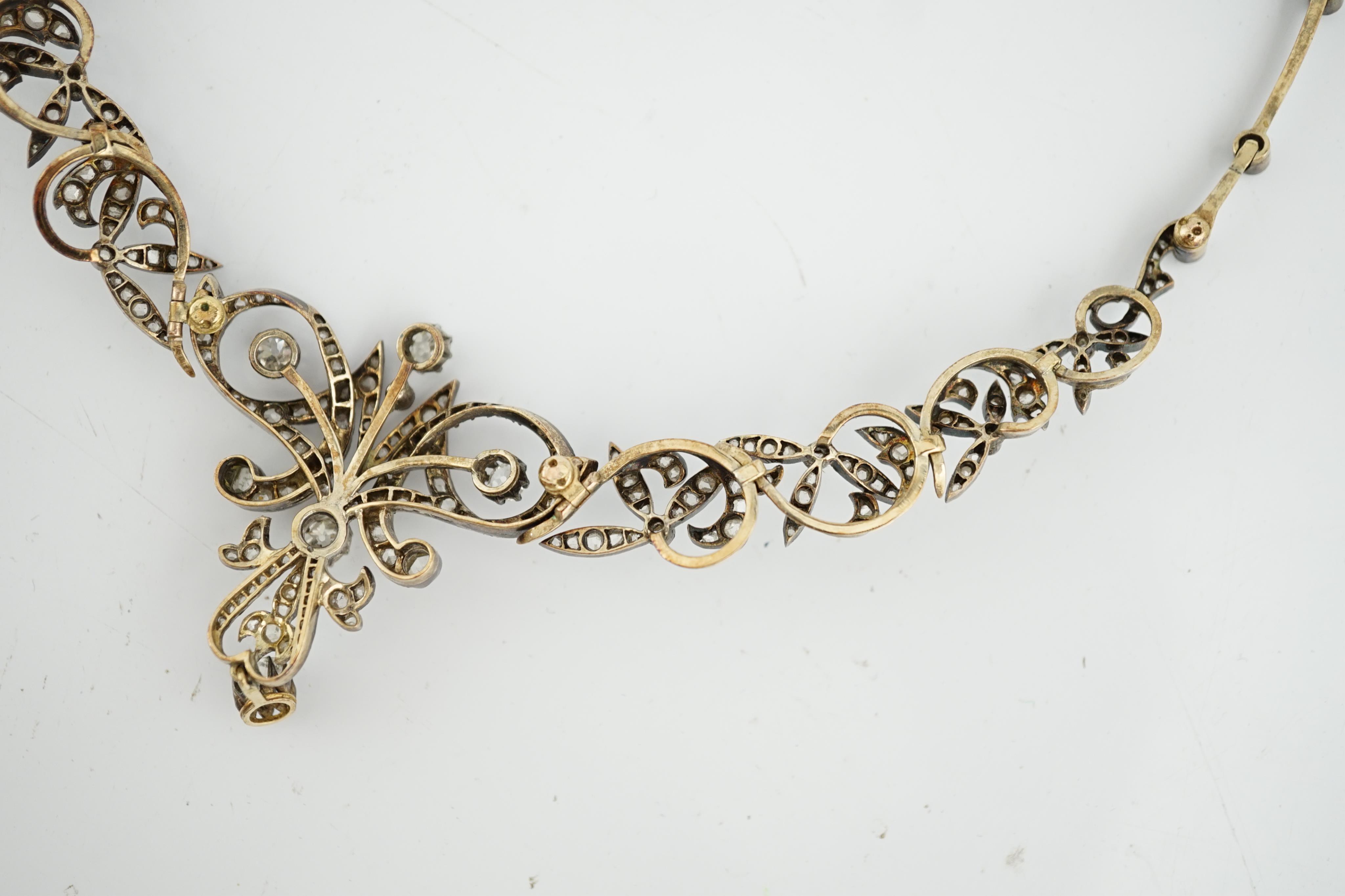 A late 19th/early 20th century French 18ct gold and silver, old mine and rose cut diamond cluster set tiara/necklace